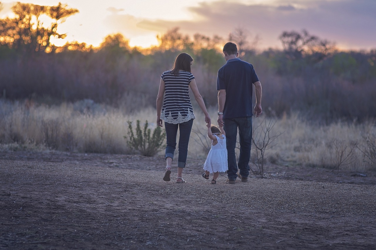 Family walking together on the countryside: date night for parents