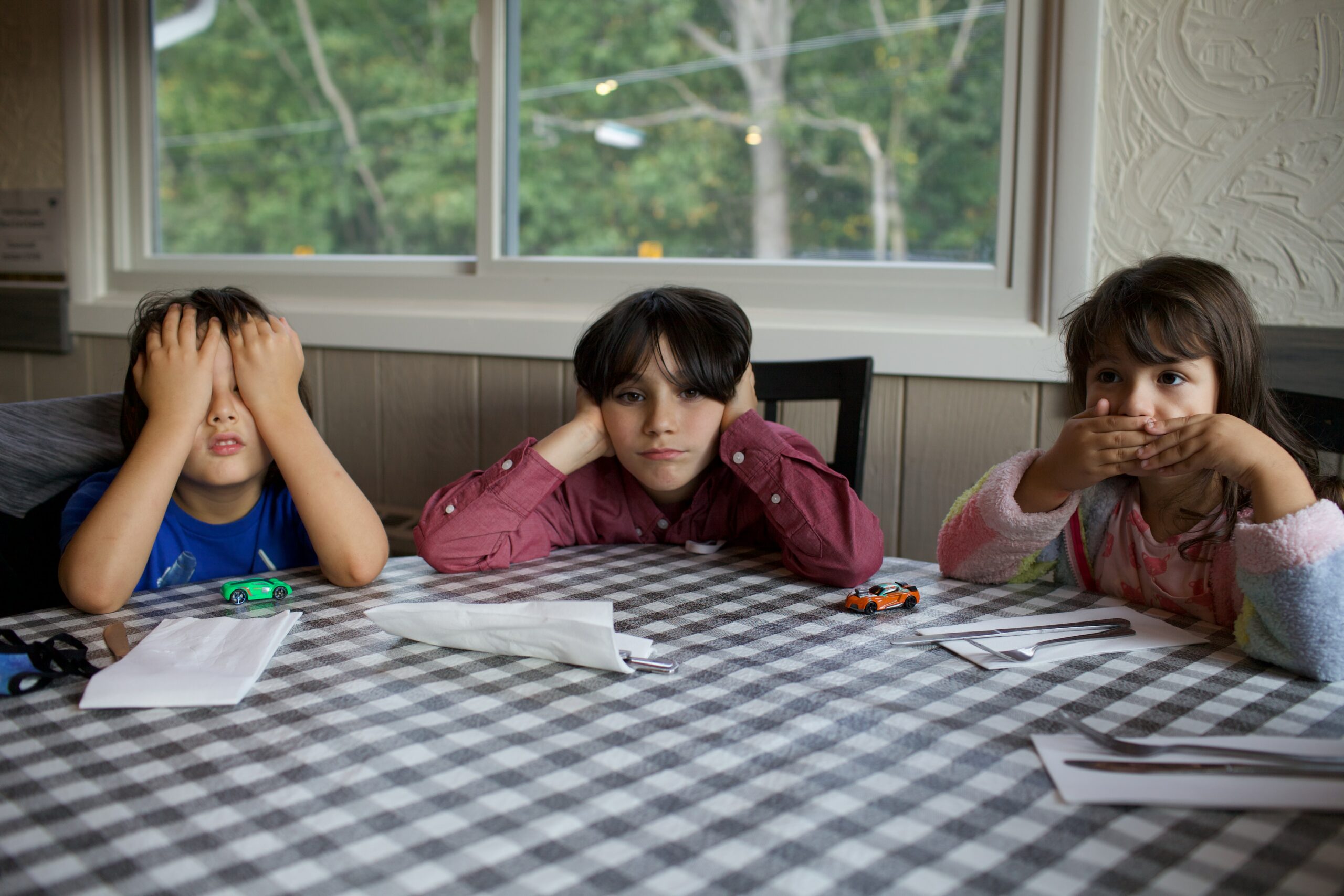 Three children sitting around a table: separation parenting