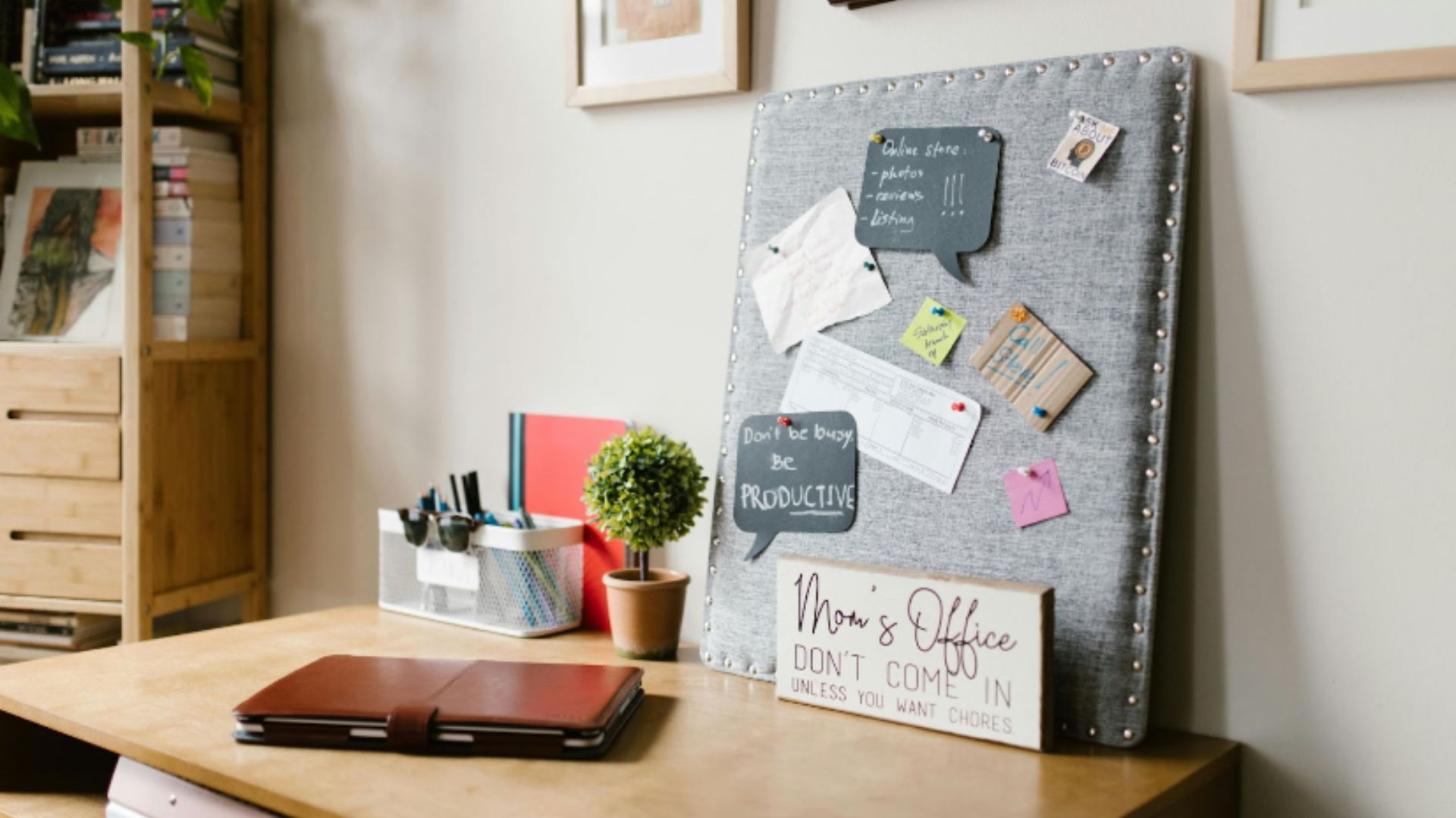 At-home office set up with corkboard of reminders and signs: art of multi-tasking